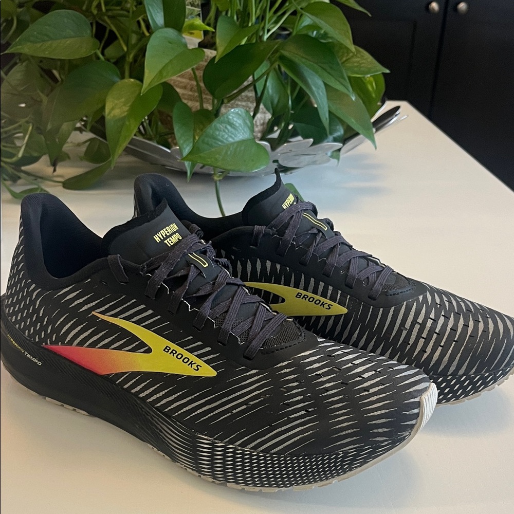 Brooks Black and White Running Shoes with Yellow and Red Accents